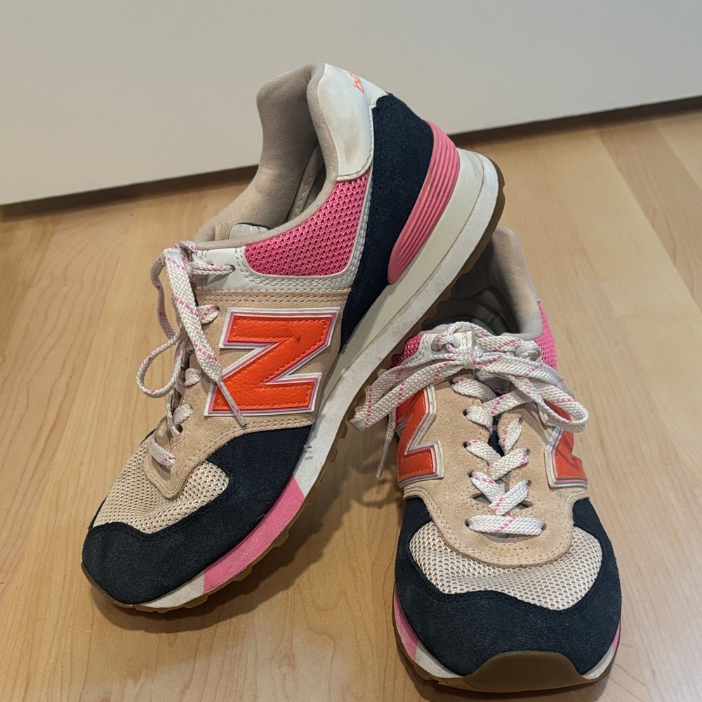 Women’s New Balance 574, size 9. Navy, pink, orange, tan, and white.